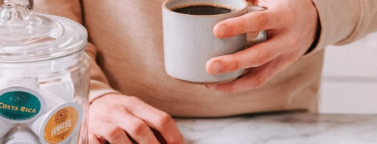 Person holding coffee mug