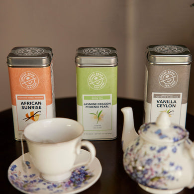 Tins of tea and porcelain teapot